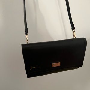 Kate Spade crossbody wallet with zippered compartment for phone & other items.